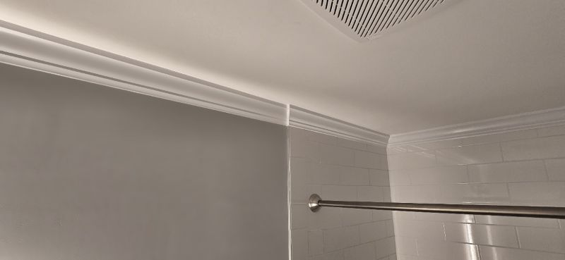 Finish carpentry — crown molding installed in a bathroom